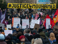 More than a thousand people take part in a demonstration against the latest court verdict over the police shooting that results in the death...