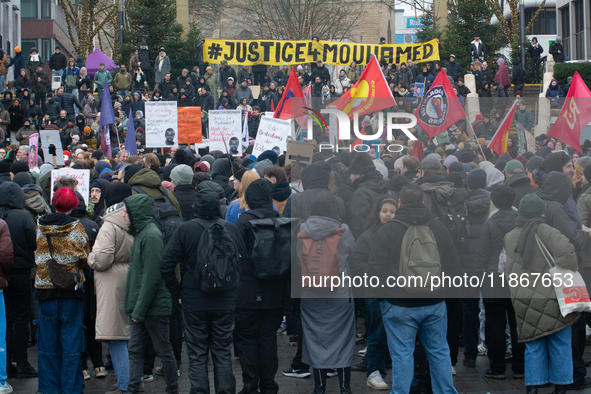 More than a thousand people take part in a demonstration against the latest court verdict over the police shooting that results in the death...