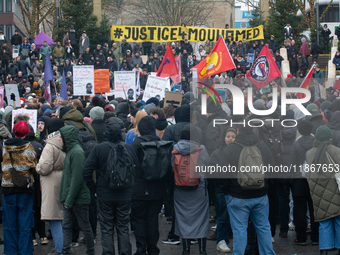 More than a thousand people take part in a demonstration against the latest court verdict over the police shooting that results in the death...