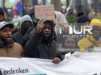 More than a thousand people take part in a demonstration against the latest court verdict over the police shooting that results in the death...