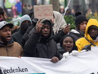 More than a thousand people take part in a demonstration against the latest court verdict over the police shooting that results in the death...