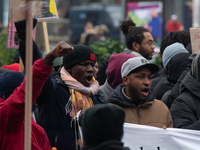 More than a thousand people take part in a demonstration against the latest court verdict over the police shooting that results in the death...