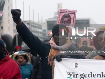 More than a thousand people take part in a demonstration against the latest court verdict over the police shooting that results in the death...