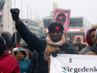 More than a thousand people take part in a demonstration against the latest court verdict over the police shooting that results in the death...