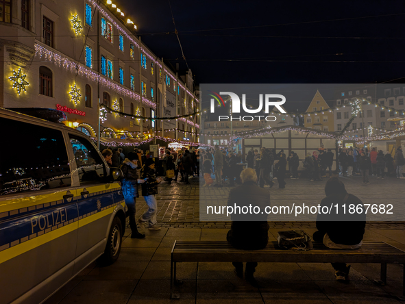 Enhanced security at the Christmas market in Augsburg, Bavaria, Germany, ensures a safe and festive atmosphere on December 14, 2024. The Chr...