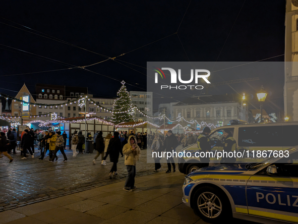 Police ensure safety during the bustling Christmas market in Augsburg, Bavaria, Germany, on December 14, 2024. The Christmas market in Augsb...