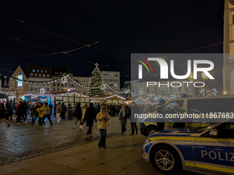 Police ensure safety during the bustling Christmas market in Augsburg, Bavaria, Germany, on December 14, 2024. The Christmas market in Augsb...