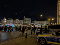 Police ensure safety during the bustling Christmas market in Augsburg, Bavaria, Germany, on December 14, 2024. The Christmas market in Augsb...