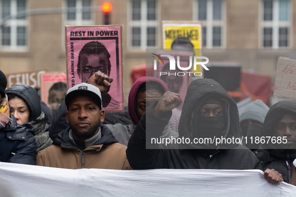 More than a thousand people take part in a demonstration against the latest court verdict over the police shooting that results in the death...