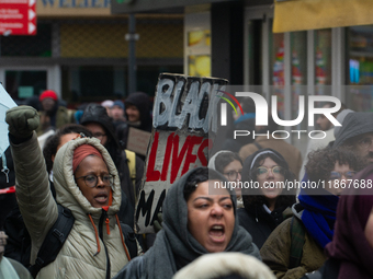 More than a thousand people take part in a demonstration against the latest court verdict over the police shooting that results in the death...