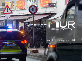 A hundred police officers observe as more than a thousand people take part in a demonstration against the latest court verdict over the poli...