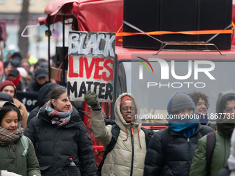 More than a thousand people take part in a demonstration against the latest court verdict over the police shooting that results in the death...