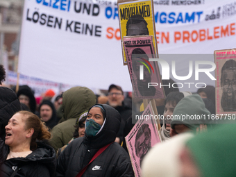 More than a thousand people take part in a demonstration against the latest court verdict over the police shooting that results in the death...