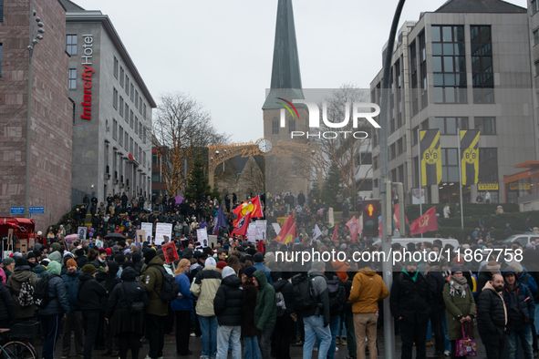 More than a thousand people take part in a demonstration against the latest court verdict over the police shooting that results in the death...