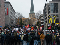 More than a thousand people take part in a demonstration against the latest court verdict over the police shooting that results in the death...