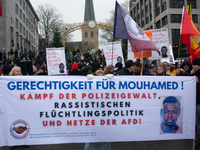 More than a thousand people take part in a demonstration against the latest court verdict over the police shooting that results in the death...