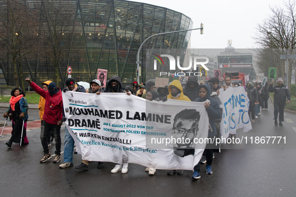 More than a thousand people take part in a demonstration against the latest court verdict over the police shooting that results in the death...