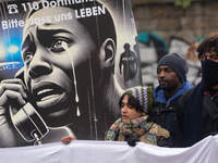 More than a thousand people take part in a demonstration against the latest court verdict over the police shooting that results in the death...