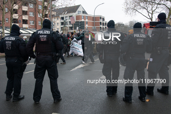 A hundred police officers observe as more than a thousand people take part in a demonstration against the latest court verdict over the poli...