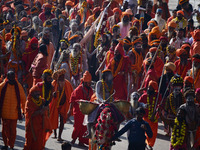 Hindu sadhus (holy men) from the Juna Akhara take part in a religious procession towards the Sangam area during the first entry for the Maha...