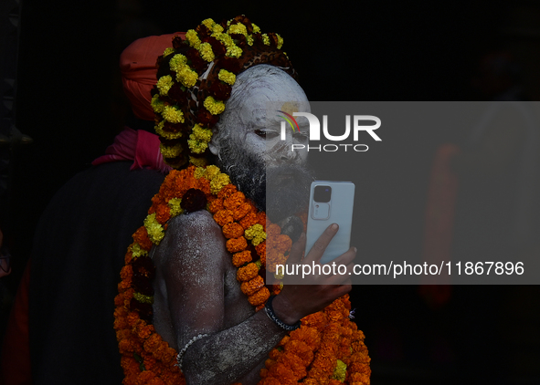 Hindu sadhus (holy men) from the Juna Akhara take part in a religious procession towards the Sangam area during the first entry for the Maha...