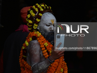 Hindu sadhus (holy men) from the Juna Akhara take part in a religious procession towards the Sangam area during the first entry for the Maha...