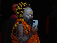 Hindu sadhus (holy men) from the Juna Akhara take part in a religious procession towards the Sangam area during the first entry for the Maha...