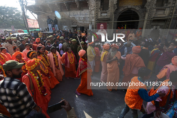 Hindu sadhus (holy men) from the Juna Akhara take part in a religious procession towards the Sangam area during the first entry for the Maha...