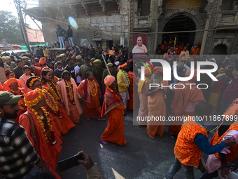 Hindu sadhus (holy men) from the Juna Akhara take part in a religious procession towards the Sangam area during the first entry for the Maha...