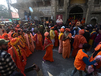 Hindu sadhus (holy men) from the Juna Akhara take part in a religious procession towards the Sangam area during the first entry for the Maha...