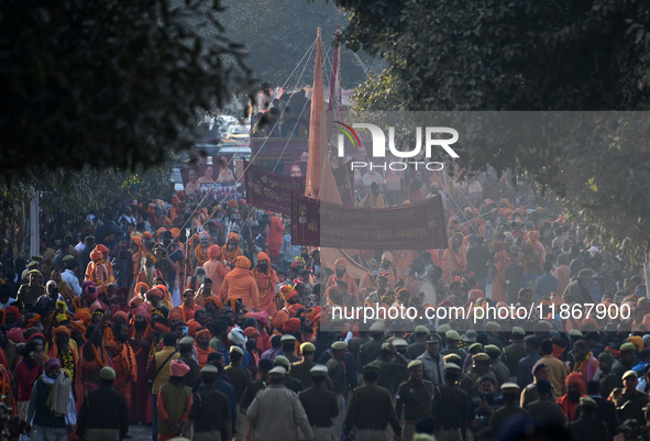 Hindu sadhus (holy men) from the Juna Akhara take part in a religious procession towards the Sangam area during the first entry for the Maha...