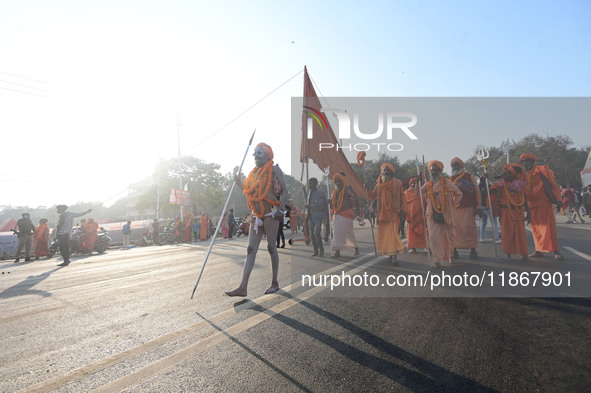 Hindu sadhus (holy men) from the Juna Akhara take part in a religious procession towards the Sangam area during the first entry for the Maha...