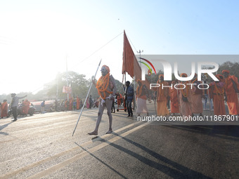 Hindu sadhus (holy men) from the Juna Akhara take part in a religious procession towards the Sangam area during the first entry for the Maha...