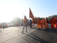 Hindu sadhus (holy men) from the Juna Akhara take part in a religious procession towards the Sangam area during the first entry for the Maha...