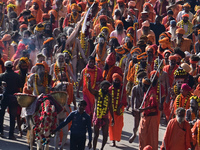 Hindu sadhus (holy men) from the Juna Akhara take part in a religious procession towards the Sangam area during the first entry for the Maha...