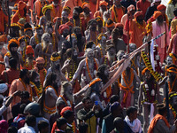 Hindu sadhus (holy men) from the Juna Akhara take part in a religious procession towards the Sangam area during the first entry for the Maha...