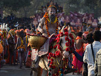 Hindu sadhus (holy men) from the Juna Akhara take part in a religious procession towards the Sangam area during the first entry for the Maha...