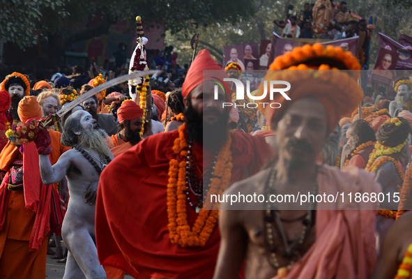 Hindu sadhus (holy men) from the Juna Akhara take part in a religious procession towards the Sangam area during the first entry for the Maha...