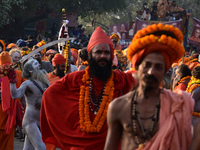 Hindu sadhus (holy men) from the Juna Akhara take part in a religious procession towards the Sangam area during the first entry for the Maha...