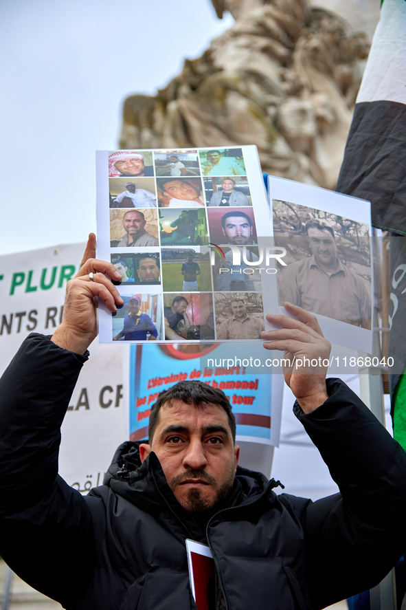 Members of the Syrian community celebrate and wave Syrian independence flags while shouting slogans during a rally in support of the Syrian...