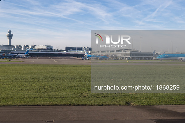 Aerial panoramic view of Amsterdam Airport Schiphol AMS EHAM from a departing airplane window with a JetBlue Airbus A321LR and a Boeing 737...