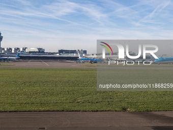 Aerial panoramic view of Amsterdam Airport Schiphol AMS EHAM from a departing airplane window with a JetBlue Airbus A321LR and a Boeing 737...