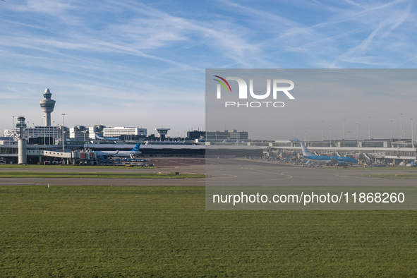 Aerial panoramic view of Amsterdam Airport Schiphol AMS EHAM from a departing airplane window with a JetBlue Airbus A321LR and a Boeing 737...