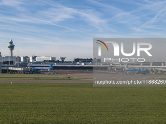 Aerial panoramic view of Amsterdam Airport Schiphol AMS EHAM from a departing airplane window with a JetBlue Airbus A321LR and a Boeing 737...