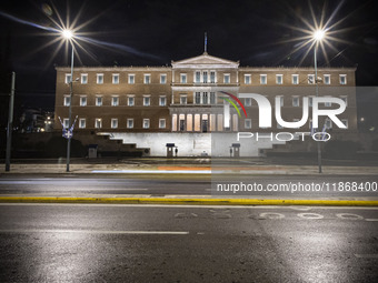 Night view of the Greek Parliament building officially known as The Parliament of the Hellenes or the Hellenic Parliament next to Syntagma S...