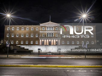 Night view of the Greek Parliament building officially known as The Parliament of the Hellenes or the Hellenic Parliament next to Syntagma S...