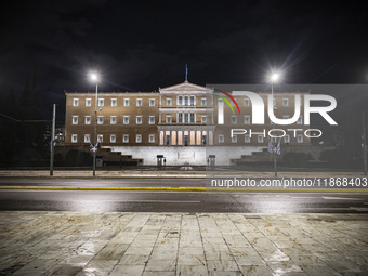 Night view of the Greek Parliament building officially known as The Parliament of the Hellenes or the Hellenic Parliament next to Syntagma S...