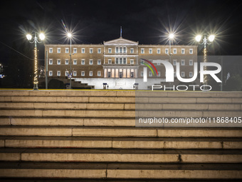 Night view of the Greek Parliament building officially known as The Parliament of the Hellenes or the Hellenic Parliament next to Syntagma S...