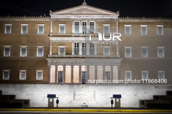 Night view of the Greek Parliament building officially known as The Parliament of the Hellenes or the Hellenic Parliament next to Syntagma S...