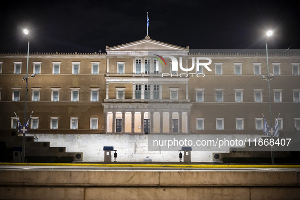 Night view of the Greek Parliament building officially known as The Parliament of the Hellenes or the Hellenic Parliament next to Syntagma S...